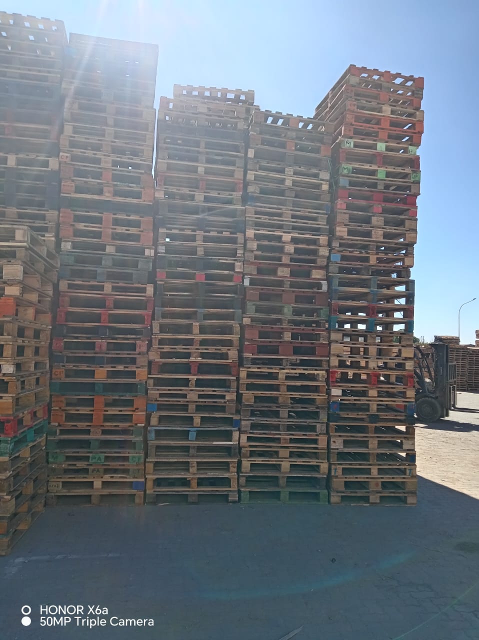 Stacked wooden pallets in a warehouse